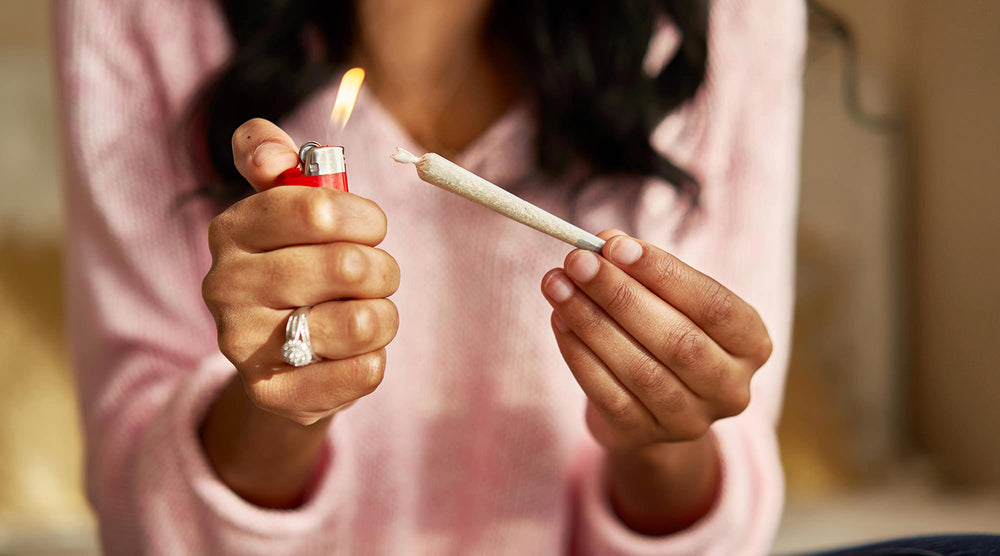 woman lighting a fresh joint